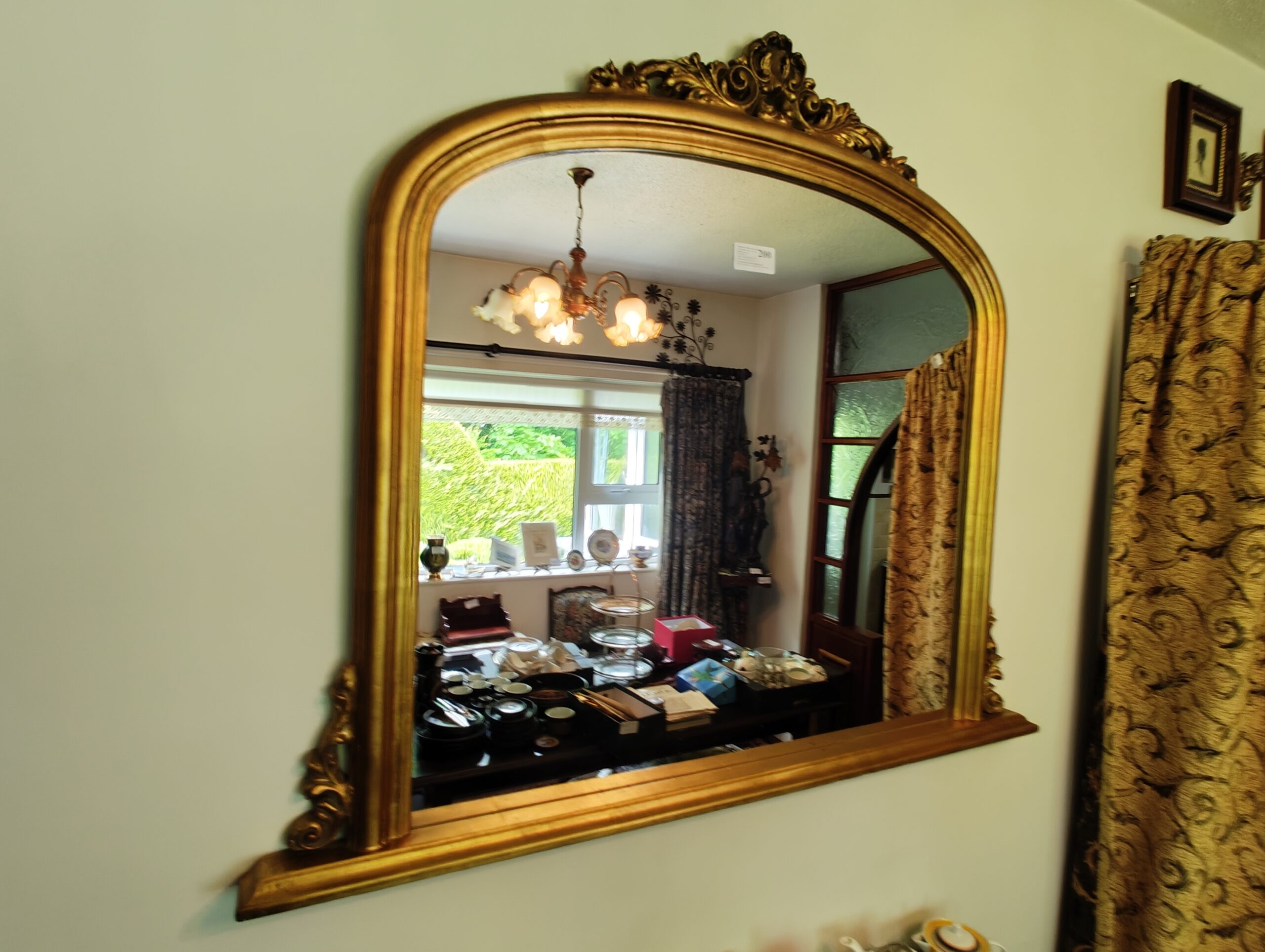 Gilt Victorian-style over-mantel mirror