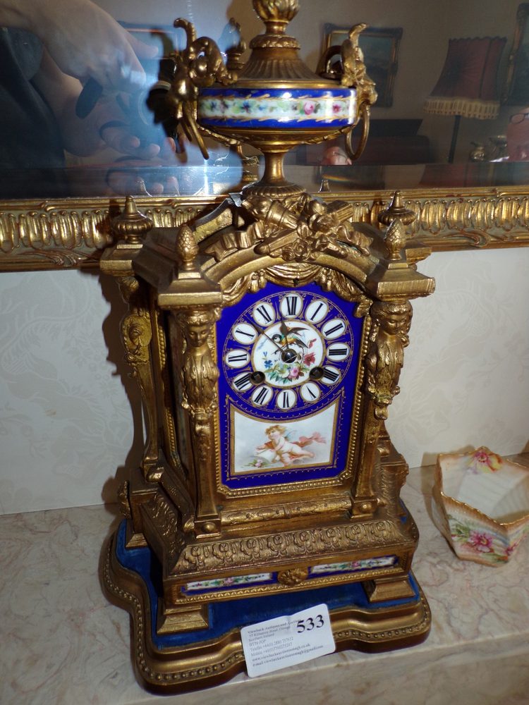 French Empire mantel clock with Sevres panels