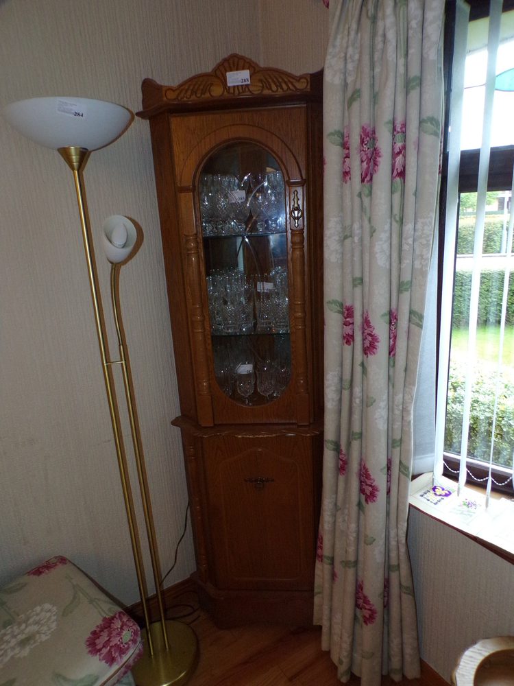 Mirror-backed oak corner cabinet