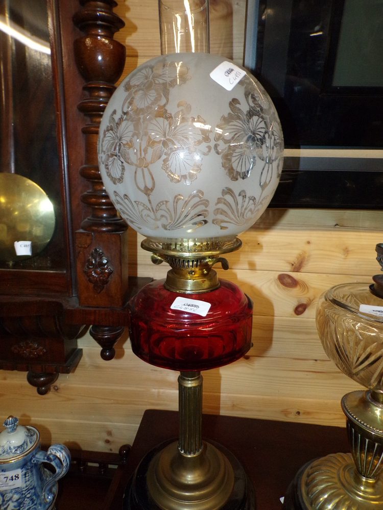 Victorian oil lamp with ruby bowl and football shade