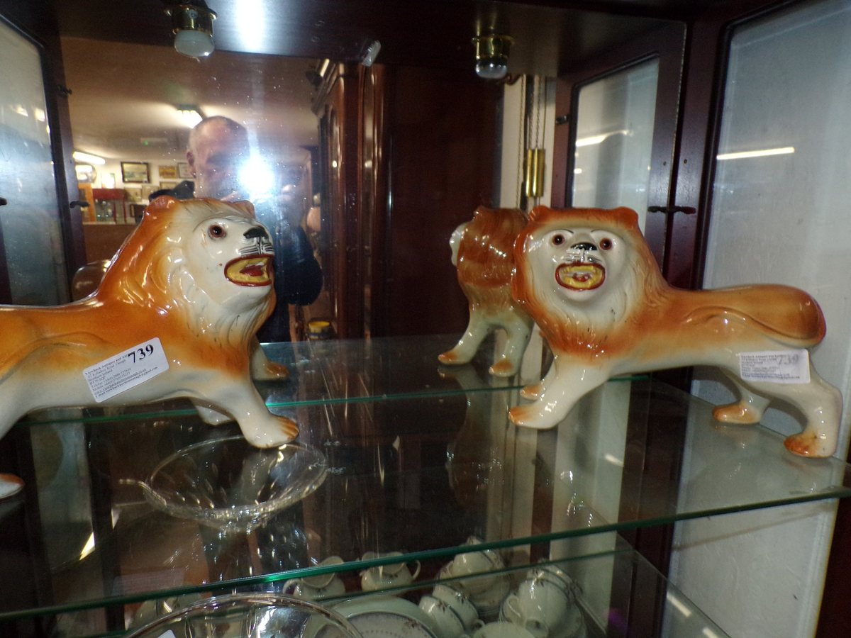 Pair of early 19th century Staffordshire lions